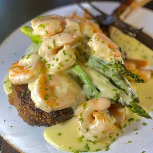 Tomahawk Steak with Shrimp, Asparagus, and Cheddar Sauce